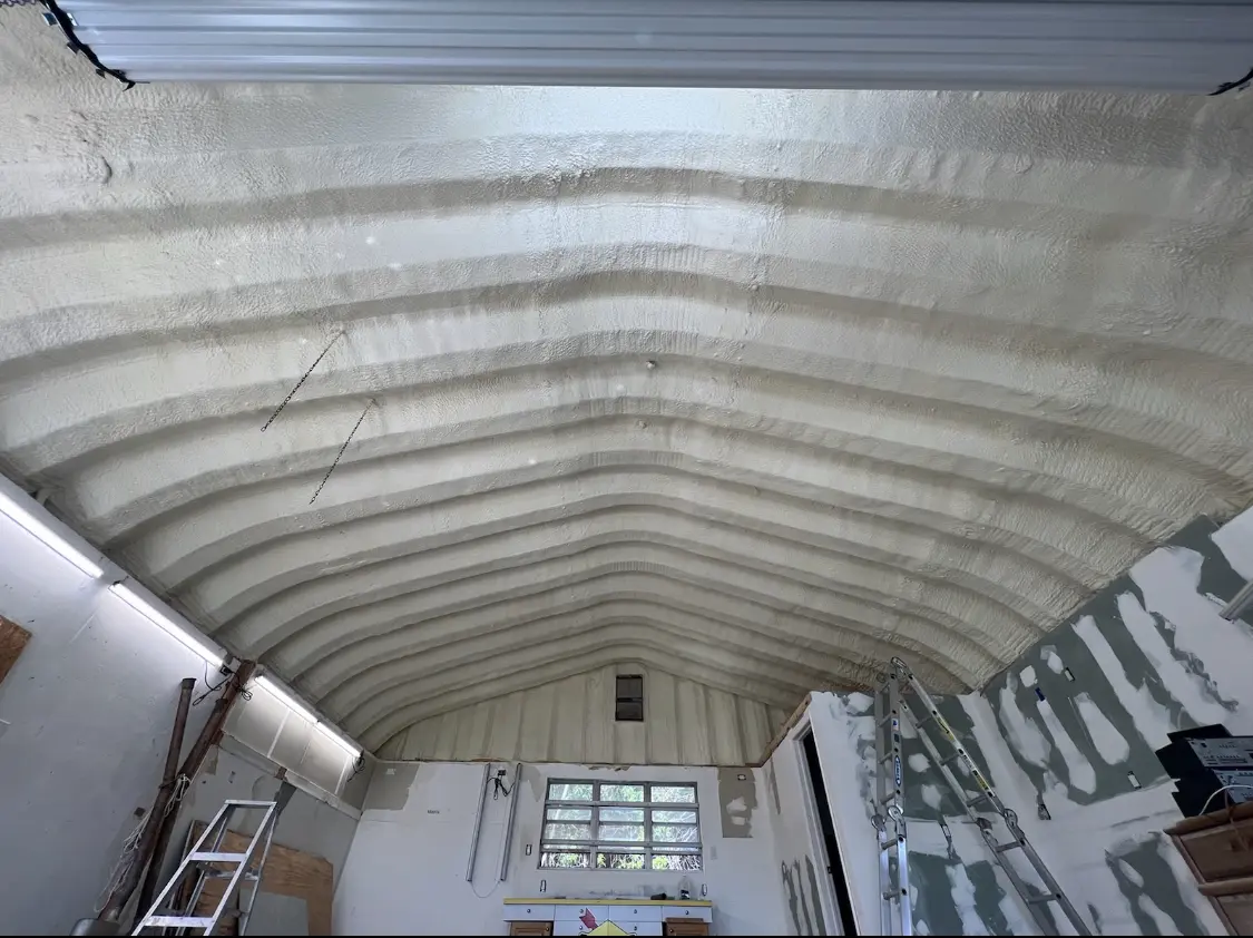 Spray polyurethane foam applied to the underside of a metal roof deck in Waunakee